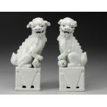 A PAIR OF CHINESE BLANC DE CHINE FU-DOGS, REPUBLIC OF CHINA, 1949 -