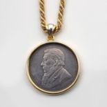 A COIN-MOUNTED PENDANT, UWE KOETTER