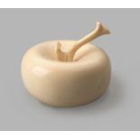 A JAPANESE IVORY OKIMONO OF AN APPLE, MEIJI PERIOD, 1868 - 1912