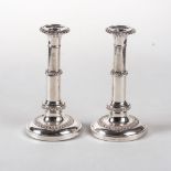 A PAIR OF ELECTROPLATE TELESCOPIC TABLE CANDLESTICKS