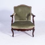 A MAHOGANY AND UPHOLSTERED ARMCHAIR