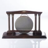 A BRASS TABLE GONG