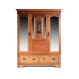 AN OAK WARDROBE, FIRST QUARTER 20th CENTURY