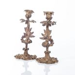 A PAIR OF ROCOCO-STYLE GILT-METAL CANDLESTICKS