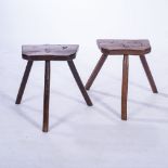 TWO WOODEN MILKING STOOLS