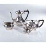 A LATE VICTORIAN FOUR-PIECE SILVER TEA SET