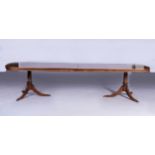 A REGENCY MAHOGANY EXTENDING DINING TABLE