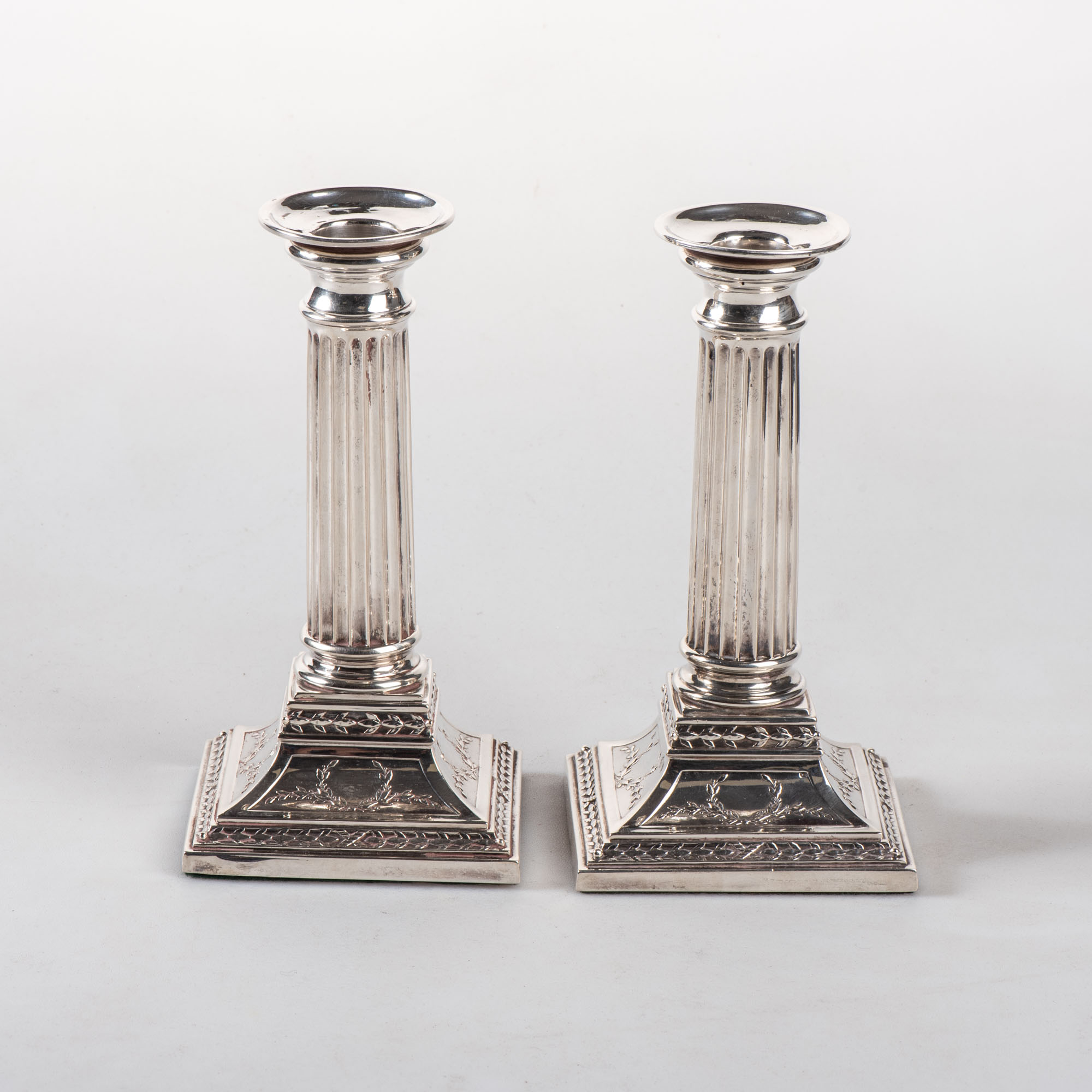 A PAIR OF DUTCH SILVER CORINTHIAN COLUMN TABLE CANDLESTICKS