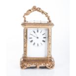 A FRENCH BRASS CARYATID CARRIAGE CLOCK, LATE 19TH CENTURY