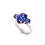 A TRILOGY TANZANITE RING WITH MICRO SET DIAMONDS