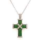 A GREEN GARNET AND DIAMOND CROSS PENDANT