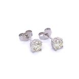 A CLASSIC PAIR OF 4 CLAW SOLITAIRE DIAMOND STUD EARRINGS