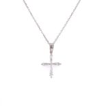 A BAGUETTE CUT DIAMOND CROSS PENDANT