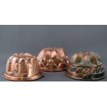 THREE COPPER JELLY MOULDS