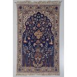 A SILK BASED ISFAHAN PRAYER RUG, IRAN