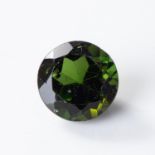 AN UNMOUNTED ROUND MIXED-CUT GREEN TOURMALINE