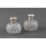 A PAIR OF VICTORIAN SILVER-MOUNTED GLASS SCENT BOTTLES AND STOPPERS, WILLIAM COMYNS &amp; SONS, LOND