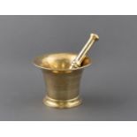 A BRASS PESTLE AND MORTAR