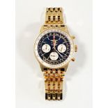 A GENTLEMAN'S 18CT GOLD WRISTWATCH,Â BREITLING NAVITIMER RATTRAPANTE