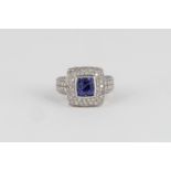 A TANZANITE AND DIAMOND RING