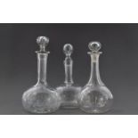 THREE ASSORTED CUT-GLASS DECANTERS