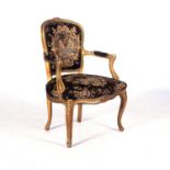 A LOUIS XVI STYLE GILTWOOD ARMCHAIR