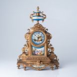 A FRENCH GILT-METAL AND PORCELAIN CLOCK