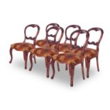 A SET OF SIX VICTORIAN WALNUT CHAIRS