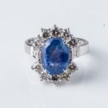 A SAPPHIRE AND DIAMOND RING