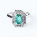 AN EMERALD AND DIAMOND RING