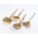 A COLLECTION OF FOUR ASSORTED BRASS STRAINING LADLES