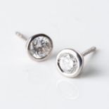 A PAIR OF DIAMOND STUDS