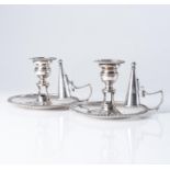 A PAIR OF GEORGE III SILVER CHAMBERSTICKS