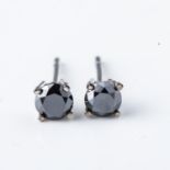 A PAIR OF DIAMOND STUD EARRINGS