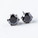 A PAIR OF DIAMOND STUD EARRINGS