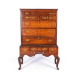 A GEORGE III WALNUT CHEST-ON-STAND