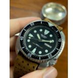 GENTLEMENS SEIKO AUTOMATIC DAY DATE WRISTWATCH REF. 6306-7001, circular black dial with lume green