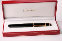 Diabolo de Cartier Fountain Pen with a black composite body, yellow golden finish trim details,