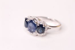 Natural Sapphire & Diamond Ring, set with 3 oval cut sapphires totalling 4.17ct, 32 round