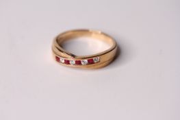 9ct Ruby and Diamond Ring, cross over band, with alternating rubies and diamonds, hallmarked 9ct ,