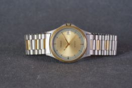 GENTLEMENS TISSOT SEASTAR DATE WRISTWATCH, circular gold two tone dial with hour markers and gold