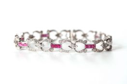 18ct Diamond and Ruby Bracelet, horse shoe Art Deco design, brilliant cut diamonds, 18cm long,