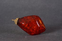 LARGE AMBER W/ 14CT GOLD PENDANT, a large piece of amber with a 14ct gold top, 70x40mm.*** Please