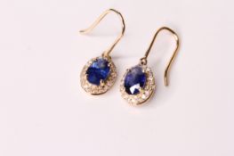 Pair of Sapphire & Diamond Earrings, set with 2 oval cut natural sapphires totalling 2.05ct,