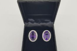 Pair of Large Oval Amethyst & Diamond Cluster Earrings, tested as 18ct yellow gold, weights are
