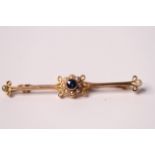 15ct Edwardian Sapphire and Pearl bar brooch, central blue sapphire within a cluster of pearls,