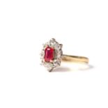 Fine Ruby and Diamond Cluster Ring, central rectangular cut ruby, estimated weight 0.58ct, set