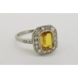 Platinum Octagonal Cut Yellow Sapphire & Diamond Ring, yellow sapphire set in a rub over setting,