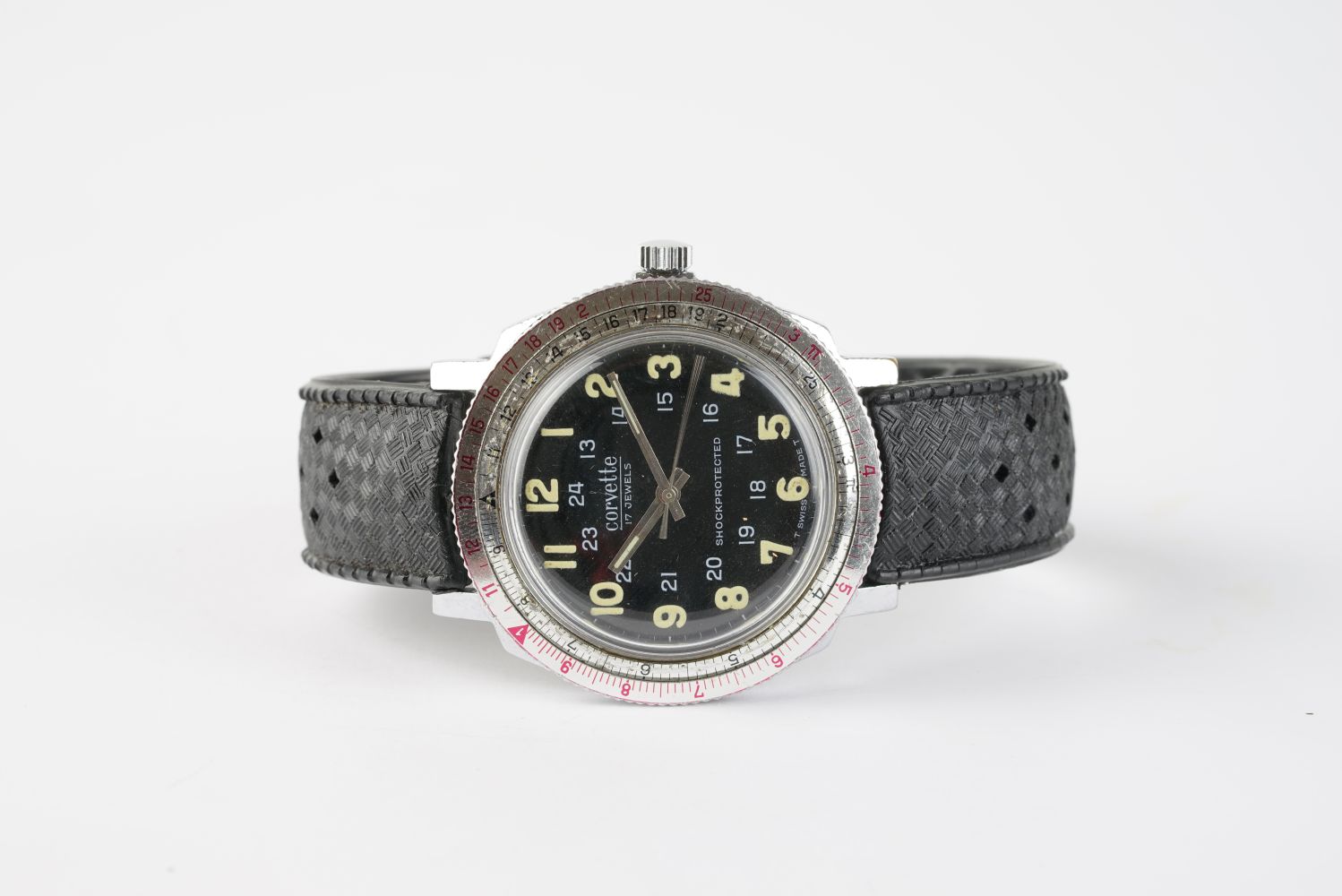 GENTLEMENS CORVETTE 24HR SLIDE RULE WRISTWATCH, circular black dial with arabic numeral hour markers