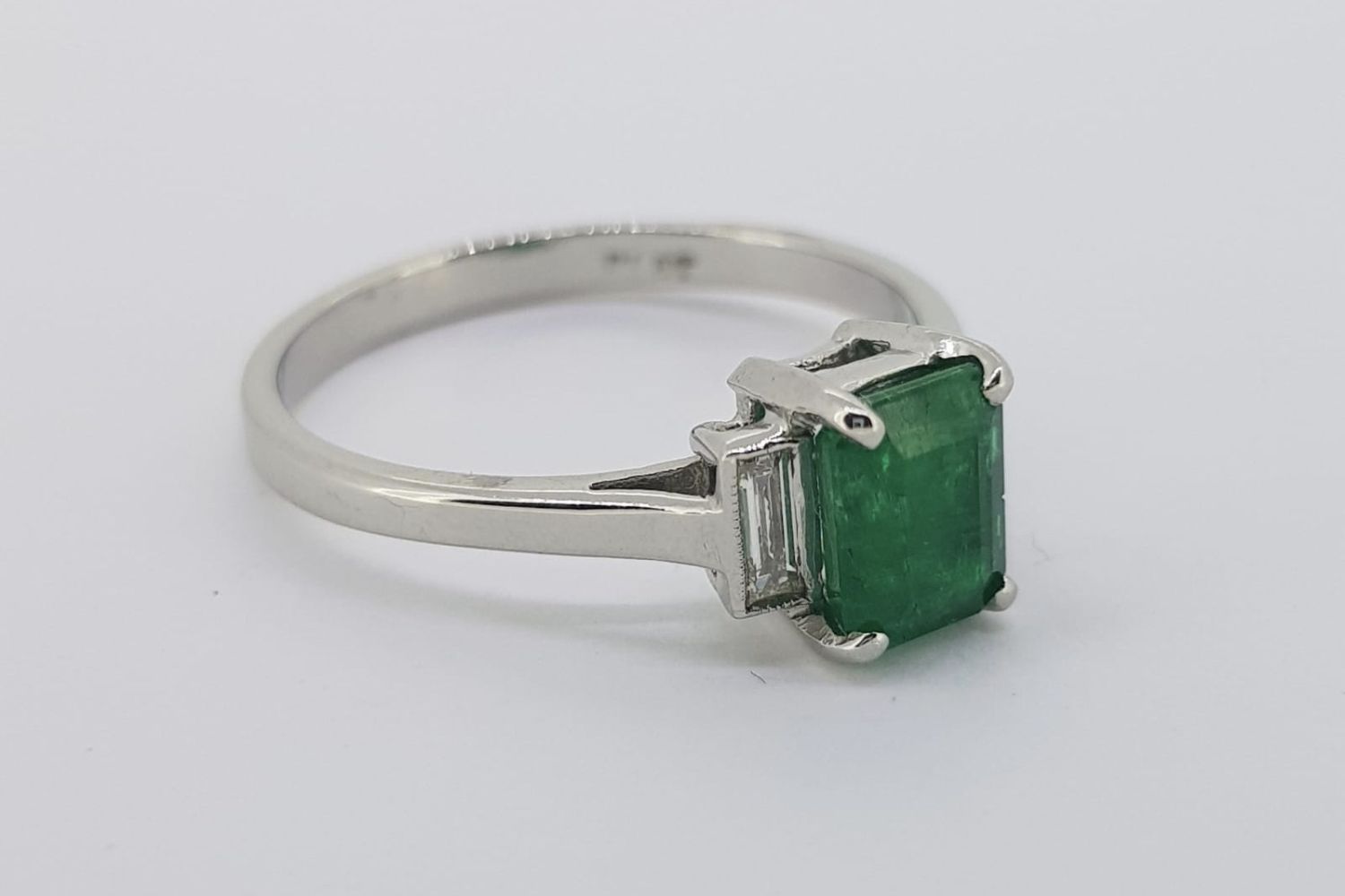 Emerald & Diamond 3 Stone Ring, central emerald cut emerald approximately 0.43ct, baguette cut